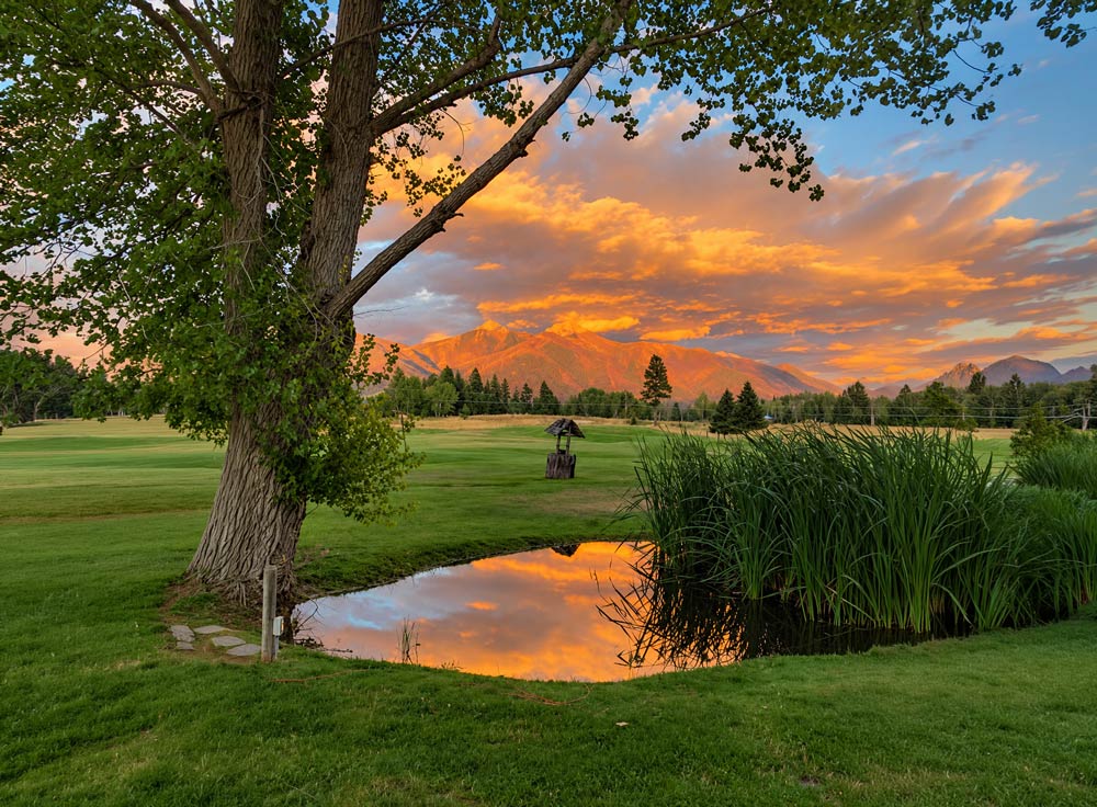 Serene Golf Course With Ponds And Fountains
